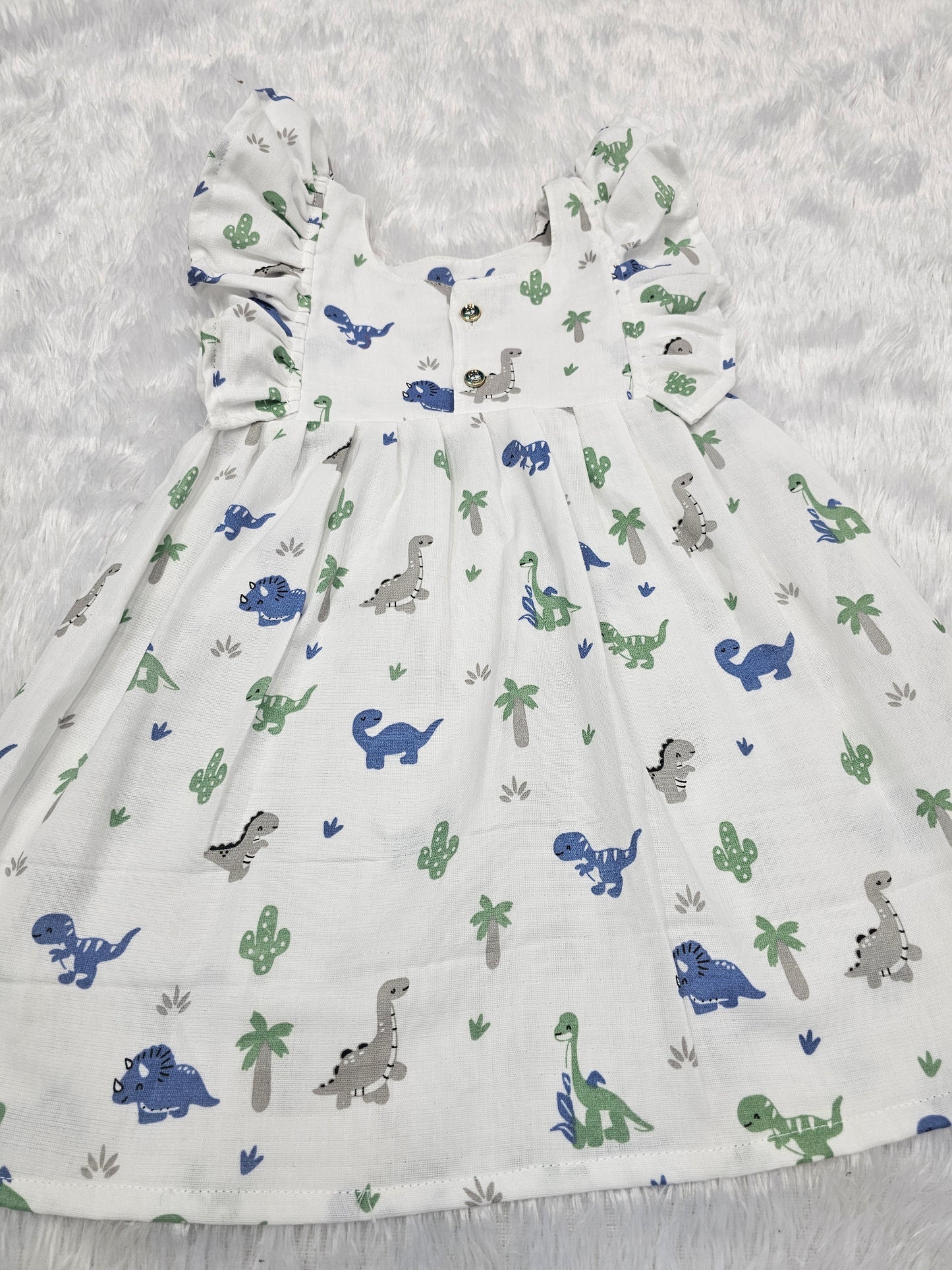 White muslin baby frock with cartoon dinosaur print and butterfly sleeves front open design – Sri Thulir Tex