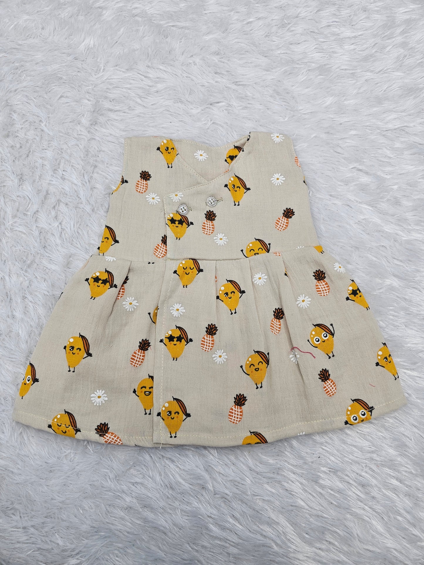 Cream muslin baby jabla frock with cute fruit and pineapple print, front open button style – Sri Thulir Tex