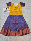 Mustard yellow and navy blue bridal silk pattu pavadai for kids with puff sleeves and peacock embroidery – Sri Thulir Tex South Indian traditional wear for girls