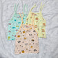 Pack of 3 newborn muslin rope type jabla tops in yellow, peach, and blue with multi printed designs.