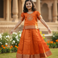 Orange semi silk pattu pavadai for girls with puff sleeve and zari border – Sri Thulir Tex