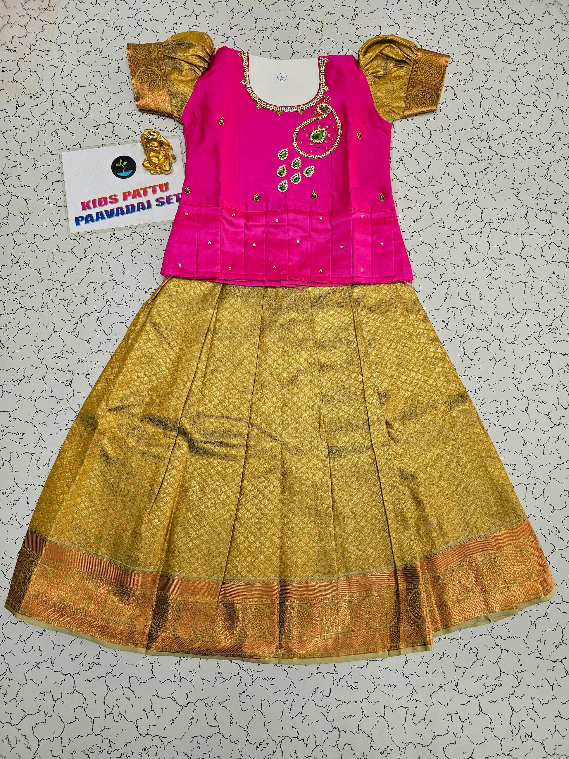 Pink and gold bridal silk pattu pavadai for kids with puff sleeves and green stone embroidery – Sri Thulir Tex South Indian traditional kids wear