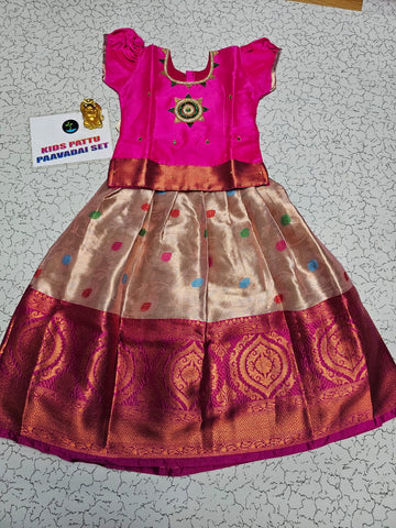 Pink and golden Banarasi semi silk pattu pavadai for girls with puff sleeves and elegant zari border – Sri Thulir Tex