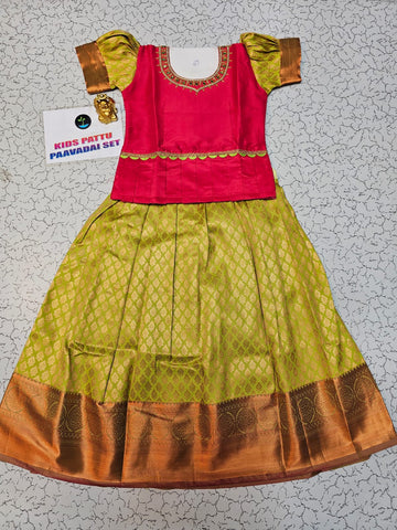 Pink and green kids pattu pavadai set with puff sleeves and bridal silk skirt by Sri Thulir Tex