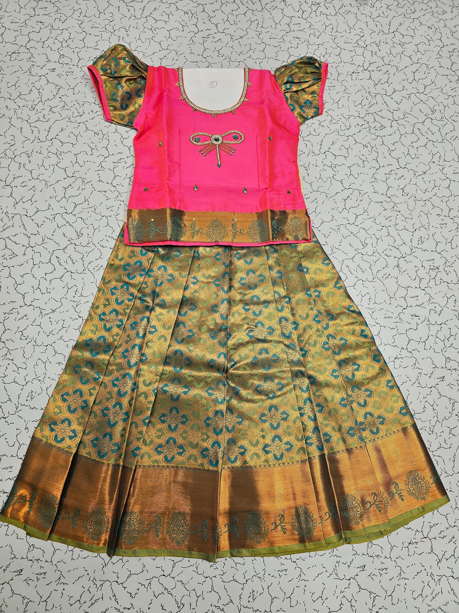 Pink and green silk pattu pavadai for girls with bow embroidery blouse and zari border skirt – Sri Thulir Tex