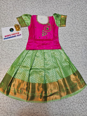 Pink and light green kids pattu pavadai set with puff sleeves and bridal silk skirt by Sri Thulir Tex