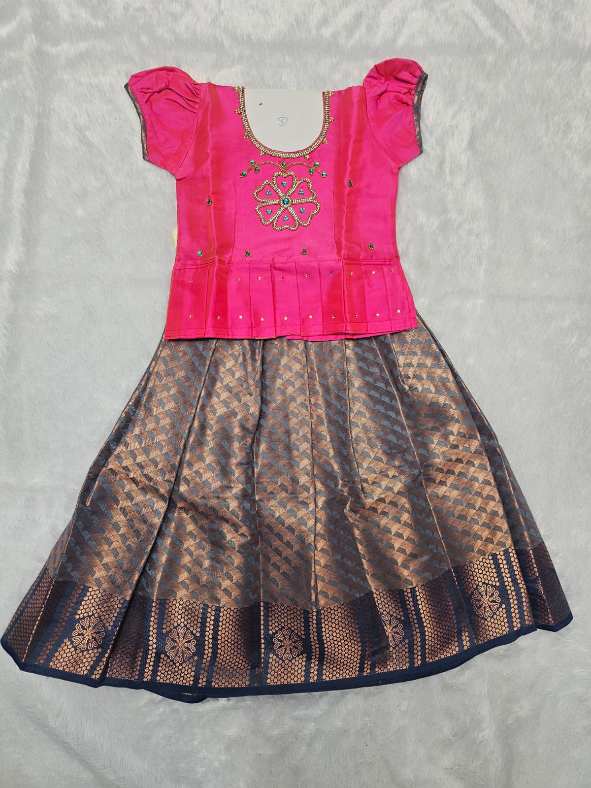 Pink semi silk and bridal silk pattu pavadai for girls with puff sleeves and stone work neck, traditional South Indian festive wear by Sri Thulir Tex