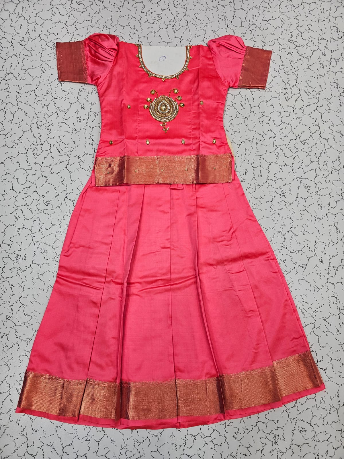 Pink semi silk pattu pavadai for girls with puff sleeve and golden zari border – Sri Thulir Tex
