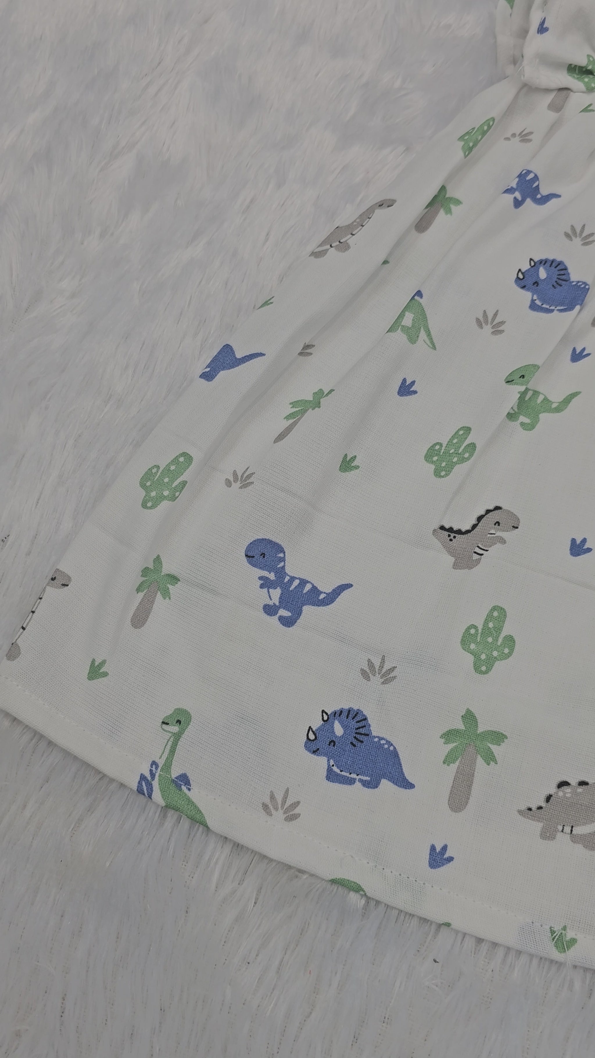 White muslin baby frock with cartoon dinosaur print and butterfly sleeves front open design – Sri Thulir Tex