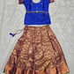 Royal blue semi silk top with antique gold bridal silk skirt pattu pavadai for girls featuring puff sleeves, waist belt design and double chain stone neck work by Sri Thulir Tex
