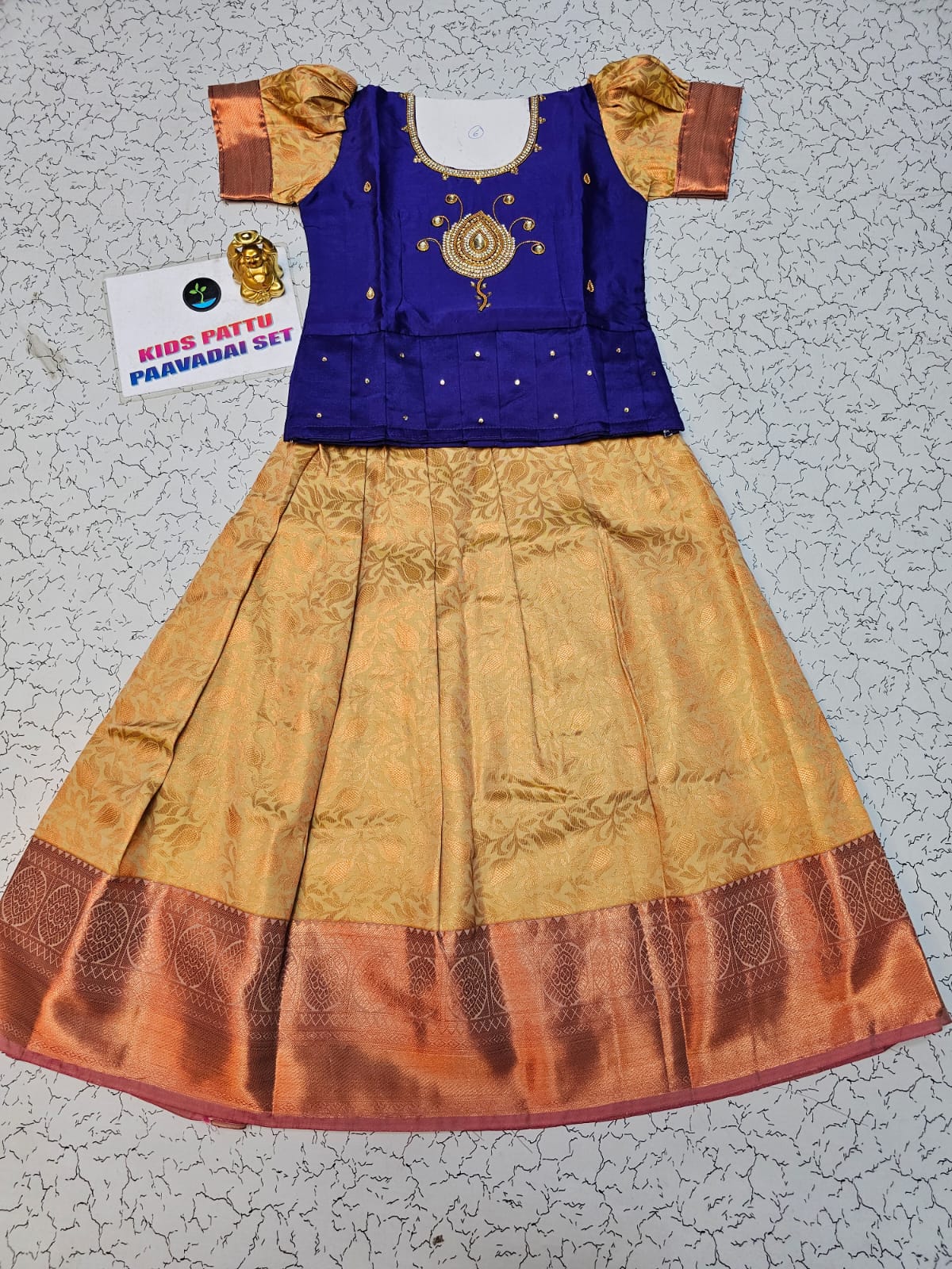Royal blue and gold kids pattu pavadai set with puff sleeves and bridal silk skirt by Sri Thulir Tex