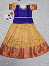 Royal purple and cream kids pattu pavadai set with puff sleeves and bridal silk skirt from Sri Thulir Tex
