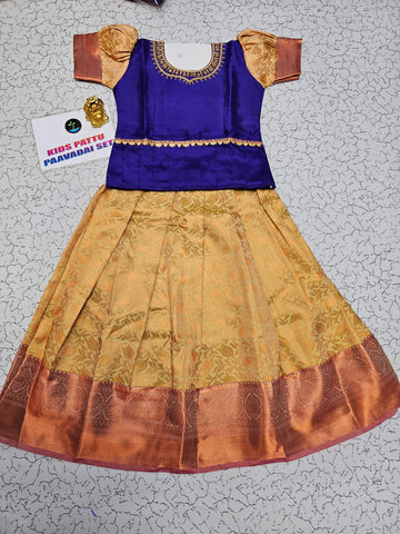 Royal purple and cream kids pattu pavadai set with puff sleeves and bridal silk skirt from Sri Thulir Tex