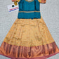 Teal blue and cream kids pattu pavadai set with puff sleeves and bridal silk skirt by Sri Thulir Tex
