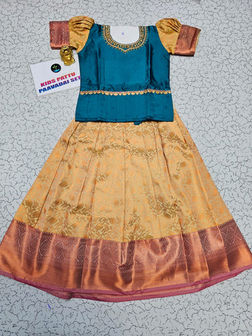 Teal blue and cream kids pattu pavadai set with puff sleeves and bridal silk skirt by Sri Thulir Tex