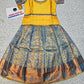 Yellow and blue kids pattu pavadai set with puff sleeves and zari bridal silk skirt by Sri Thulir Tex