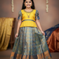 Yellow and blue kids pattu pavadai set with puff sleeves and zari bridal silk skirt by Sri Thulir Tex