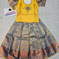 Yellow and blue kids pattu pavadai set with puff sleeves and bridal silk skirt by Sri Thulir Tex