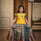 Yellow and blue kids pattu pavadai set with puff sleeves and bridal silk skirt by Sri Thulir Tex