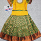 Yellow and green kids pattu pavadai set with puff sleeves and gold zari bridal silk skirt by Sri Thulir Tex