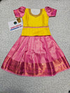 Yellow and pink kids pattu pavadai set with puff sleeves and bridal silk skirt by Sri Thulir Tex